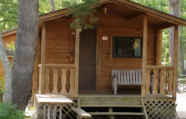 Rustic cabin exterior at Adventure Bound Eagle Valley campground